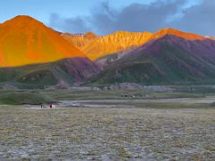 07B The slope of ITMO University Peak blazes red and orange at sunset from Ak-Sai Travel Lenin Peak Base Camp 3600m